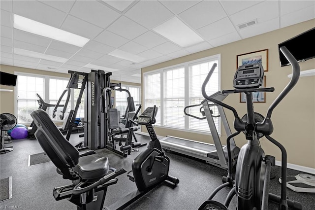 workout area featuring a paneled ceiling