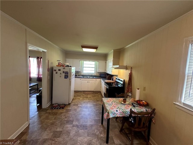 735 Fairfield St, Burlington, NC 27215 - kitchen with black appliances, ornamental molding, dark countertops, under cabinet range hood, and white cabinetry
