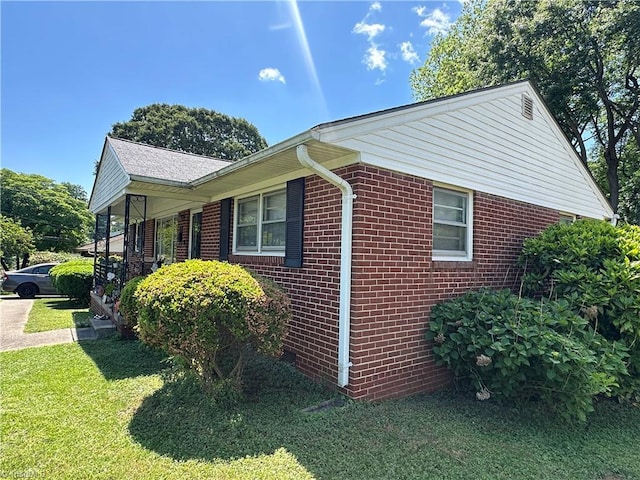 735 Fairfield St, Burlington, NC 27215 - view of side of property with brick siding and a lawn