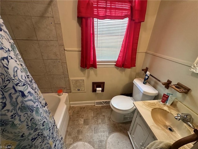 735 Fairfield St, Burlington, NC 27215 - bathroom with toilet, baseboards, and vanity