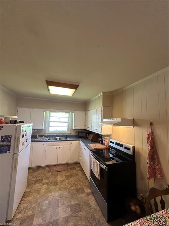 735 Fairfield St, Burlington, NC 27215 - kitchen with stainless steel electric range oven, freestanding refrigerator, dark countertops, white cabinetry, and under cabinet range hood