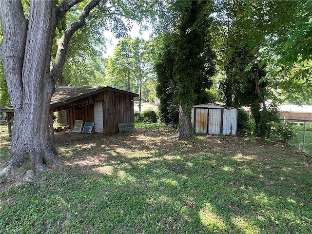 735 Fairfield St, Burlington, NC 27215 - view of yard with an outbuilding and a storage shed