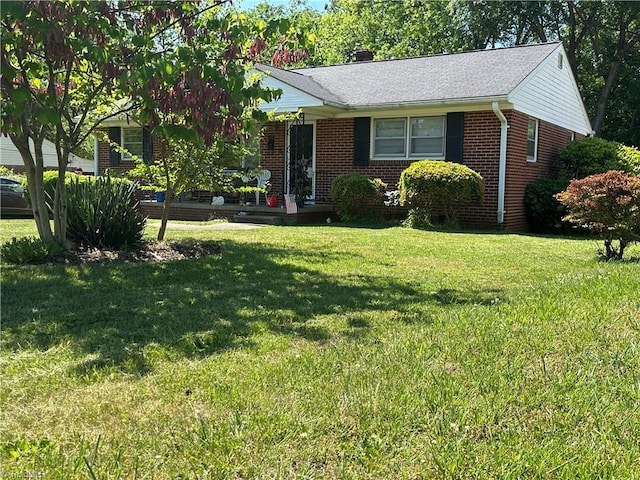 735 Fairfield St, Burlington, NC 27215 - view of front of property featuring brick siding, a front lawn, and a porch