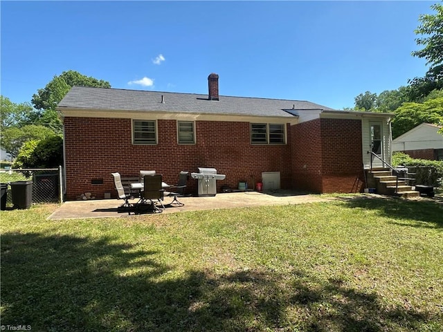 735 Fairfield St, Burlington, NC 27215 - back of property featuring crawl space, a patio, brick siding, entry steps, and a chimney