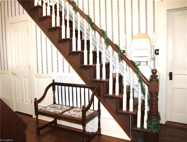 stairs featuring hardwood / wood-style flooring