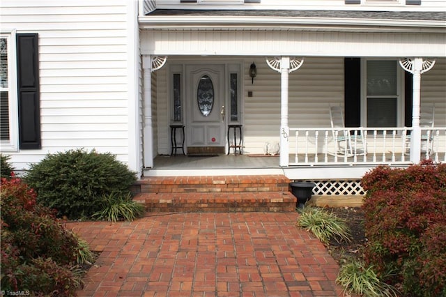 doorway to property with covered porch