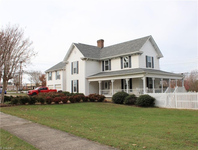 view of front of property with covered porch and a front yard