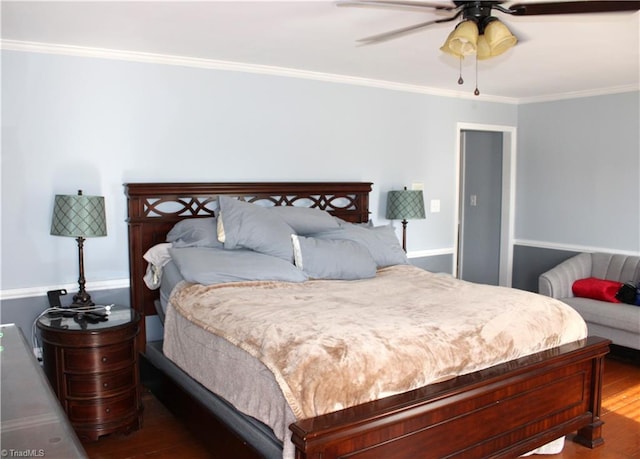 bedroom featuring hardwood / wood-style flooring, ceiling fan, and ornamental molding