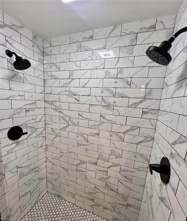 bathroom with a tile shower