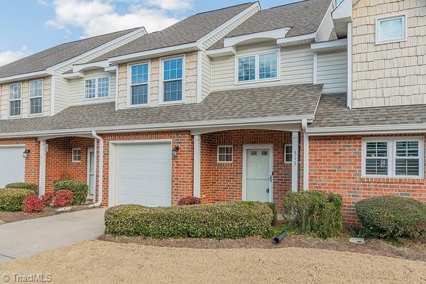 townhome / multi-family property featuring a garage