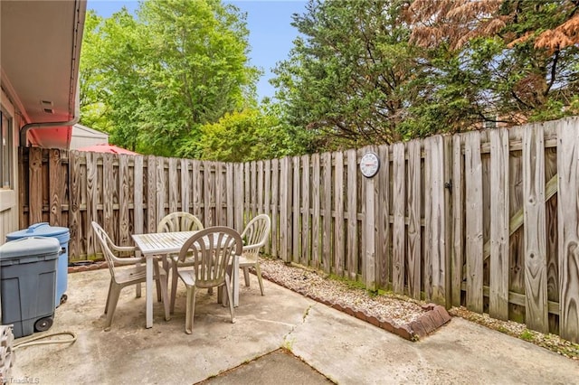 view of patio / terrace featuring outdoor dining space and a fenced backyard