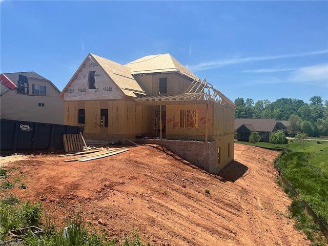 rear view of house with electric panel