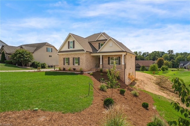 craftsman-style house with a front yard