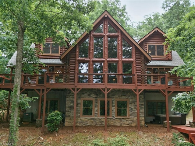 559 Dockside Ter, Denton, NC 27239 - rear view of house featuring outdoor lounge area, stone siding, central AC unit, and log siding