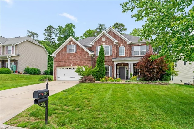 3941 Stafford Run Ct, High Point, NC 27265 - colonial inspired home featuring brick siding, driveway, an attached garage, and a front yard