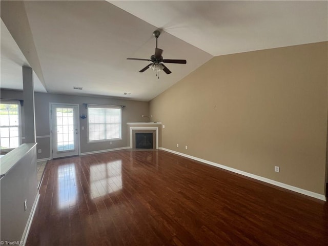 111 Braewyck Ln, King, NC 27021 - unfurnished living room featuring wood finished floors, plenty of natural light, ceiling fan, a fireplace, and vaulted ceiling