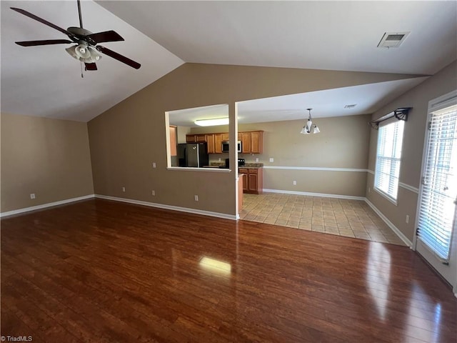 111 Braewyck Ln, King, NC 27021 - unfurnished living room with wood finished floors, lofted ceiling, and ceiling fan