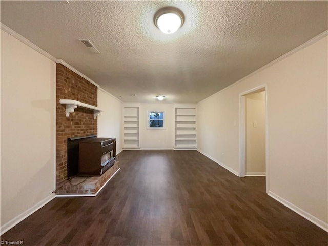 unfurnished living room with a wood stove, ornamental molding, and dark wood-type flooring