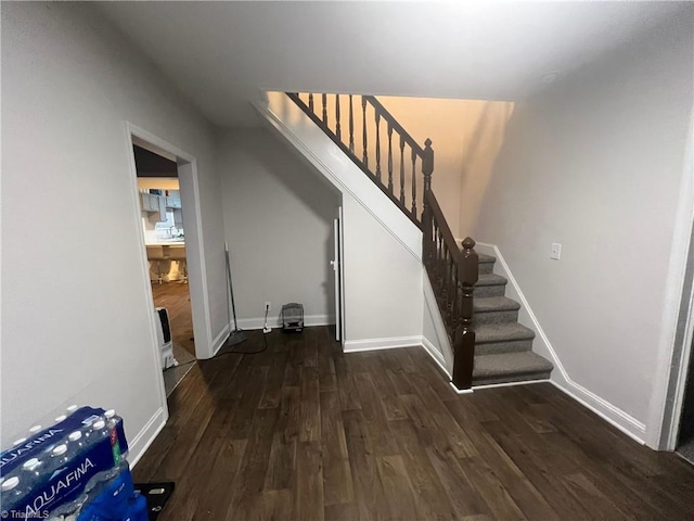 staircase featuring hardwood / wood-style floors