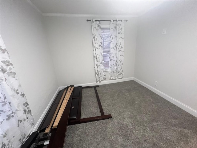 interior space with crown molding and dark colored carpet