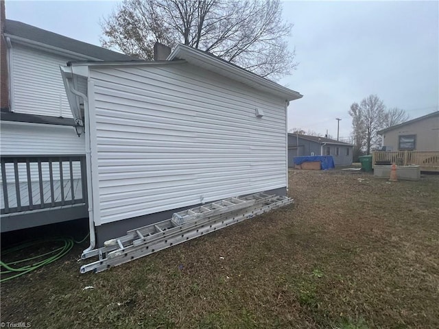 view of side of property with a wooden deck