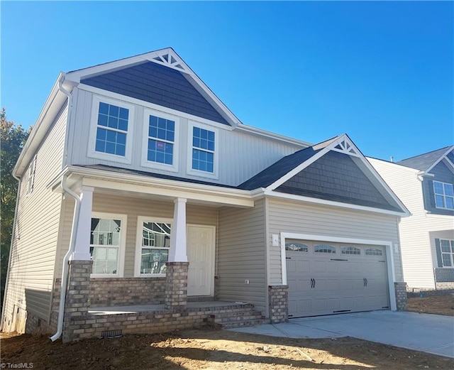 craftsman-style house with a garage and a porch