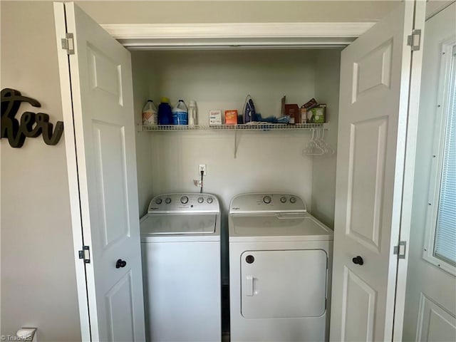 washroom with laundry area and washer and clothes dryer