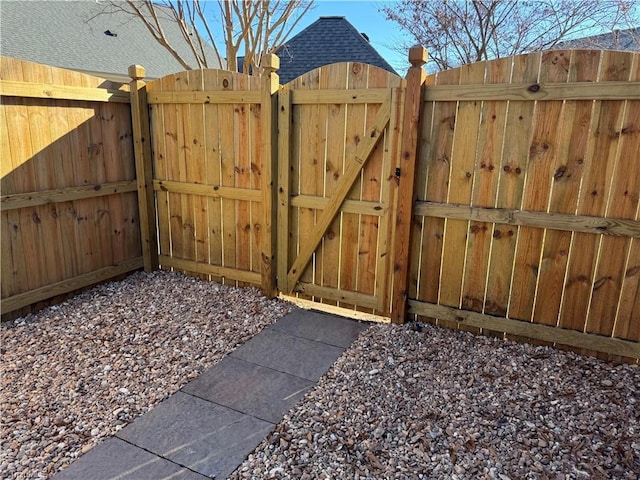 view of gate featuring fence