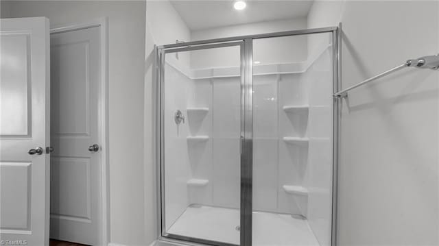 bathroom featuring a shower stall