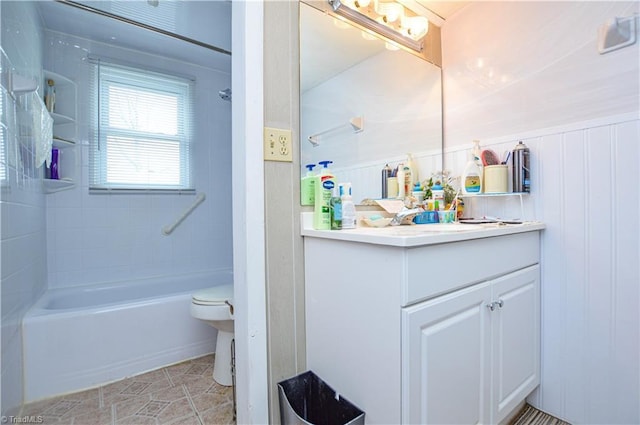 bathroom featuring vanity, tile patterned floors, toilet, and tub / shower combination