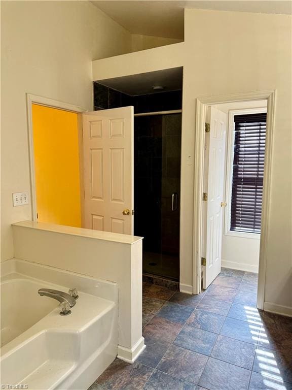 bathroom with separate shower and tub