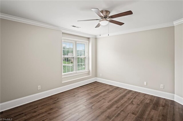 empty room featuring ceiling fan, dark hardwood / wood-style floors, and ornamental molding