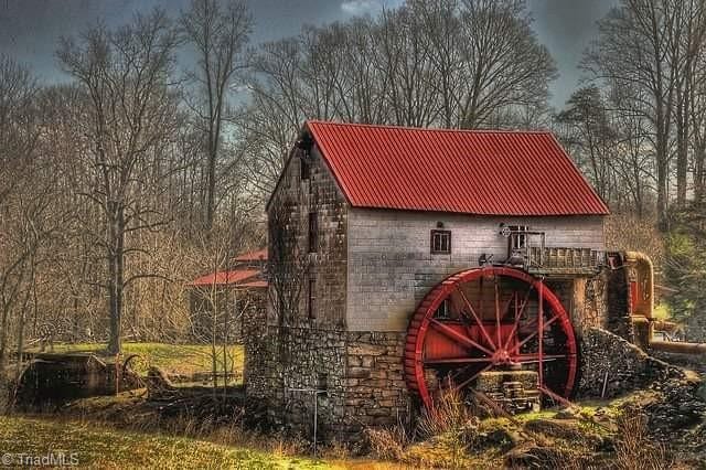 view of barn featuring a wooded view