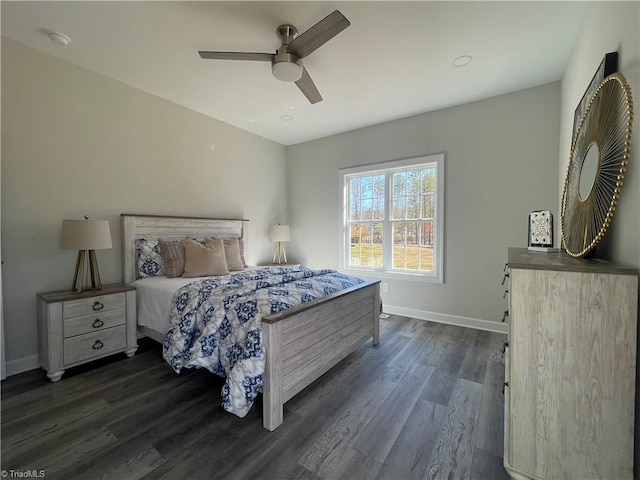 bedroom featuring dark wood finished floors, baseboards, and ceiling fan