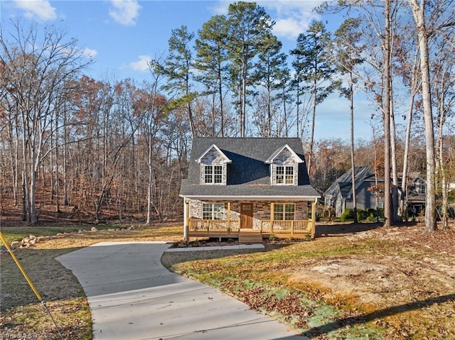 view of front of home with a porch and stone siding