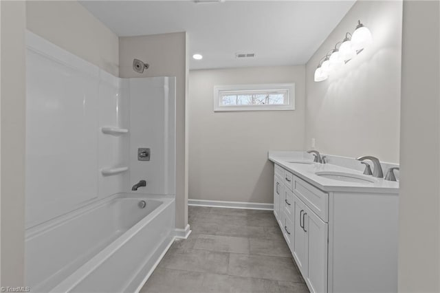 full bathroom with a sink, visible vents, baseboards, and double vanity