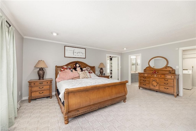 carpeted bedroom featuring crown molding, washer / dryer, ensuite bathroom, and recessed lighting
