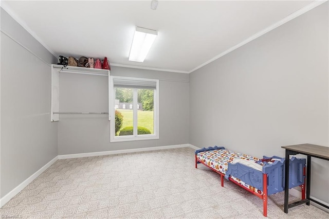 carpeted bedroom featuring ornamental molding and baseboards