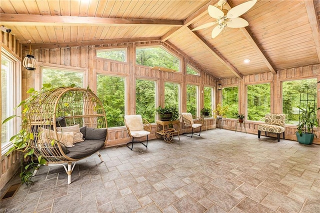 sunroom featuring ceiling fan