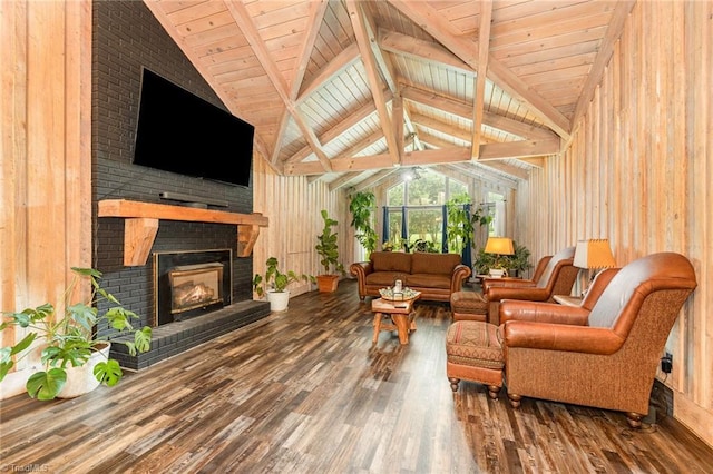 living area featuring wood finished floors, a brick fireplace, and wood ceiling