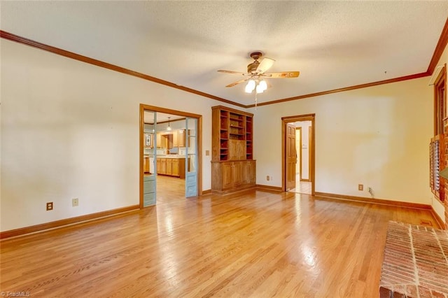 6400 Muirfield Dr, Greensboro, NC 27410 - unfurnished living room featuring ceiling fan, light wood-style floors, ornamental molding, and a textured ceiling
