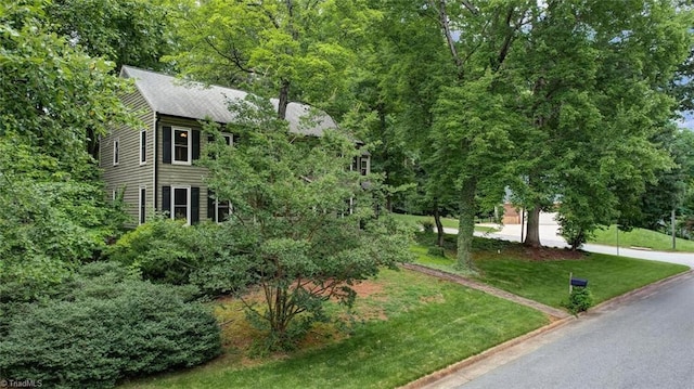 6400 Muirfield Dr, Greensboro, NC 27410 - view of front of house featuring concrete driveway and a front lawn