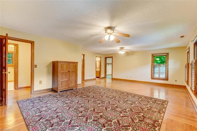 6400 Muirfield Dr, Greensboro, NC 27410 - unfurnished room with ceiling fan, light wood finished floors, and a textured ceiling