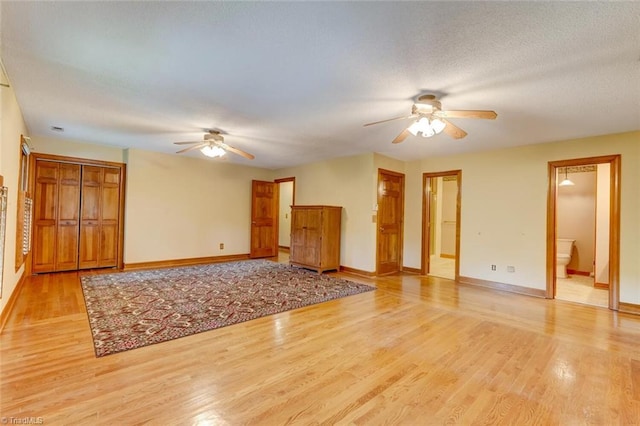6400 Muirfield Dr, Greensboro, NC 27410 - unfurnished living room featuring ceiling fan and light wood-style flooring