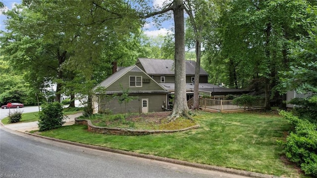 6400 Muirfield Dr, Greensboro, NC 27410 - view of front of home with a chimney and a front yard