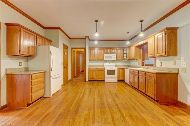 6400 Muirfield Dr, Greensboro, NC 27410 - kitchen with white appliances, light wood finished floors, light countertops, ornamental molding, and brown cabinets