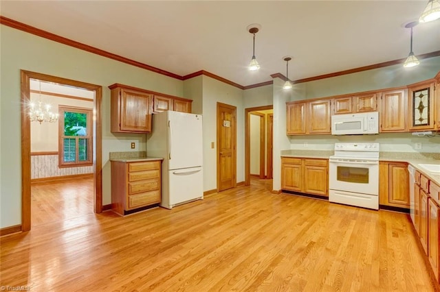6400 Muirfield Dr, Greensboro, NC 27410 - kitchen featuring white appliances, light countertops, light wood-type flooring, hanging light fixtures, and ornamental molding