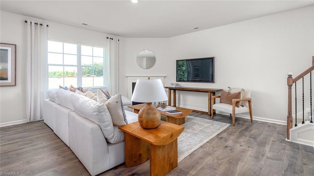 445 Tobacco Rd, Lexington, NC 27295 - living room featuring stairs, wood finished floors, baseboards, and recessed lighting