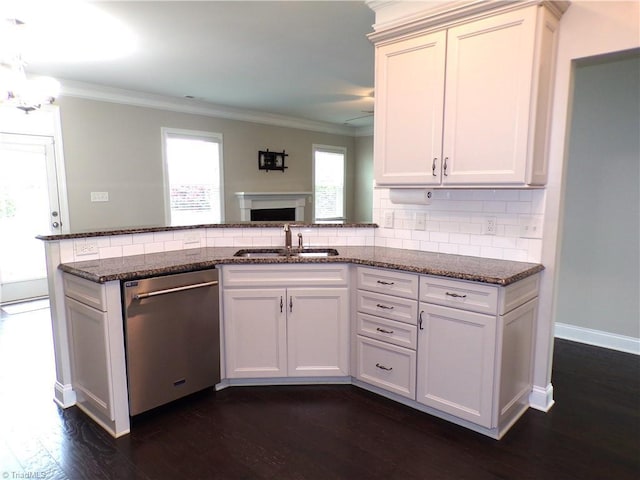 8003 Helison Ct, Stokesdale, NC 27357 - kitchen with stainless steel dishwasher, a sink, ornamental molding, dark stone counters, and tasteful backsplash