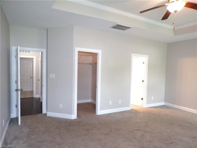 8003 Helison Ct, Stokesdale, NC 27357 - unfurnished bedroom featuring carpet, ornamental molding, baseboards, a spacious closet, and a closet